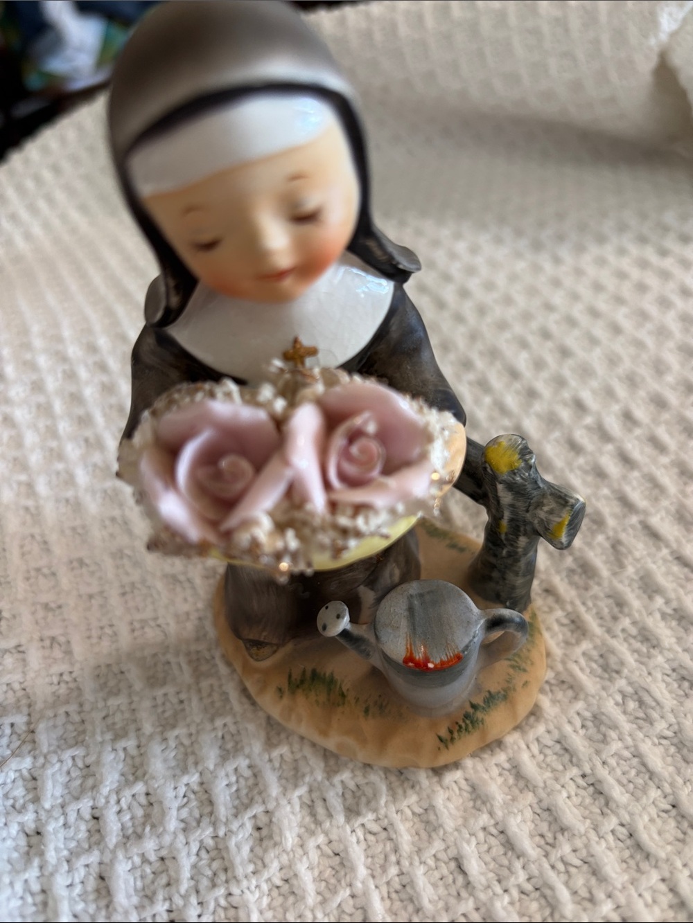 This is a vintage Napco R5279 ceramic figurine of a nun gardening